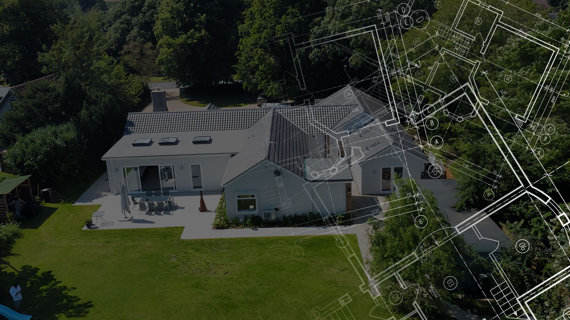 Aerial view of a completed extension in Suffolk with the architect's drawing overlaid